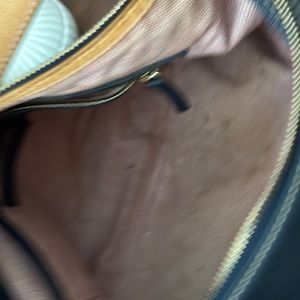 Dooney Bourke navy blue tote with side pockets.  16 inches wide and 10 tall